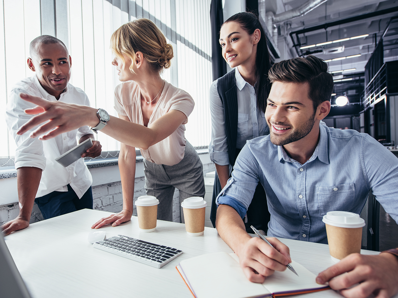 Collaboration for Improvement: Brainstorming Ways to Enhance Our Dealer Verification Process A group of professionals collaborating and discussing ways to improve the dealer verification process at Approval Heroes