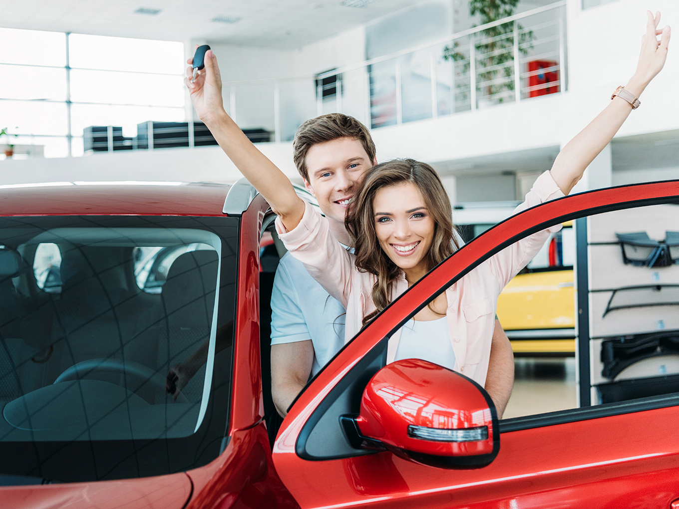 Approval Heroes - Building Trust and Satisfaction Happy Customers Celebrating New Vehicle Purchase