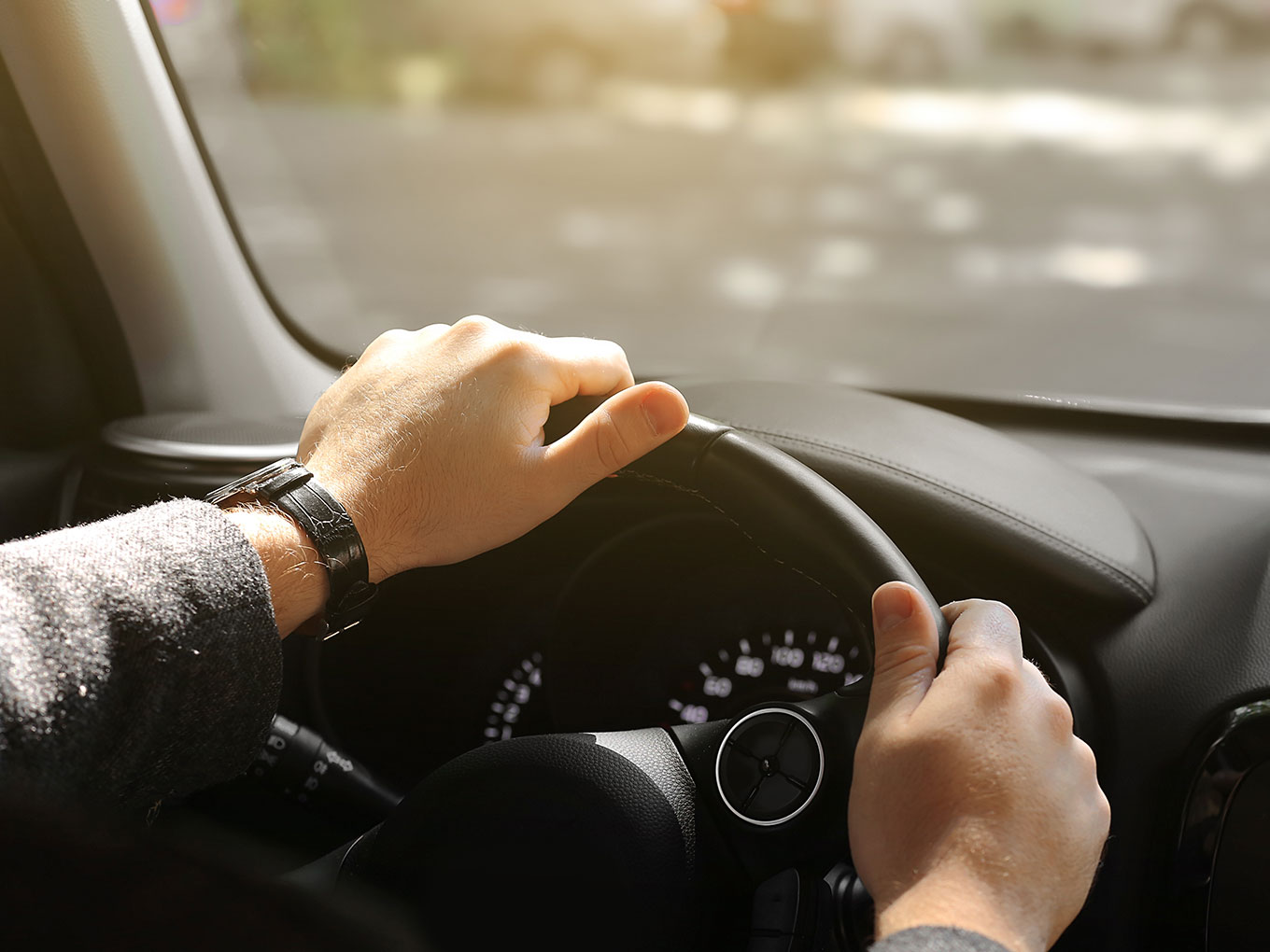 A confident driver at the wheel symbolizing the empowering journey of navigating car refinancing with Approval Heroes. Take control of your financial destiny.